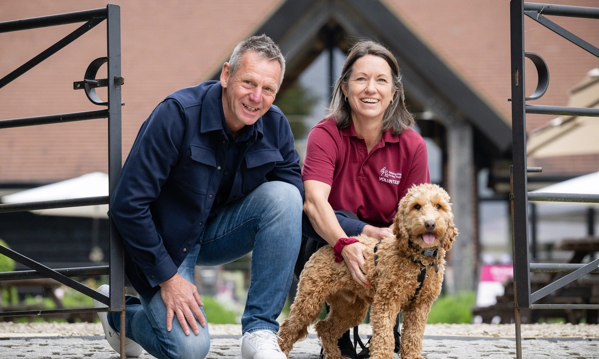 Stuart Pearce hearing links trainer and puppy