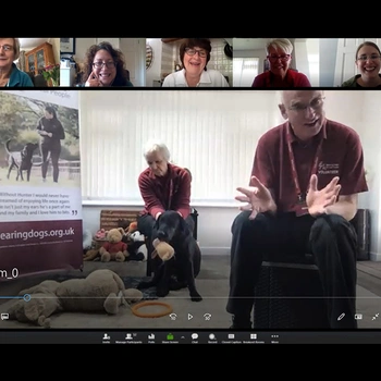Screenshot of a Hearing Dogs speaker talking to people during an online talk.